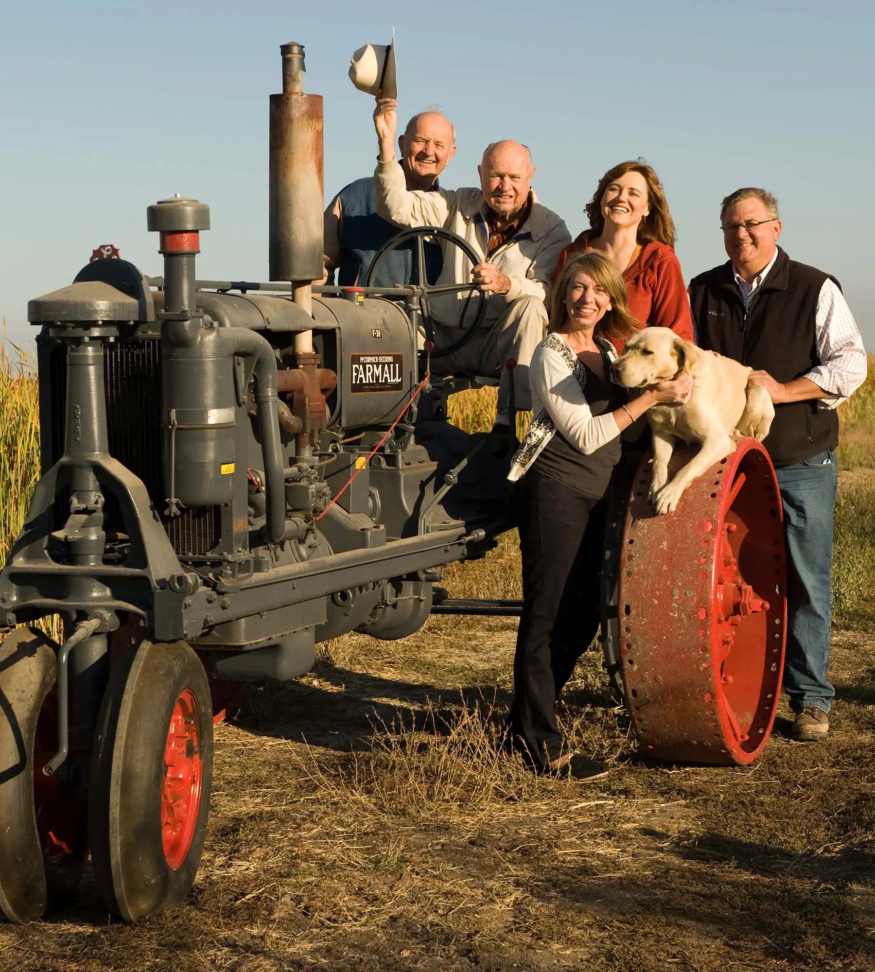 Lundberg Family members posing on a tractor