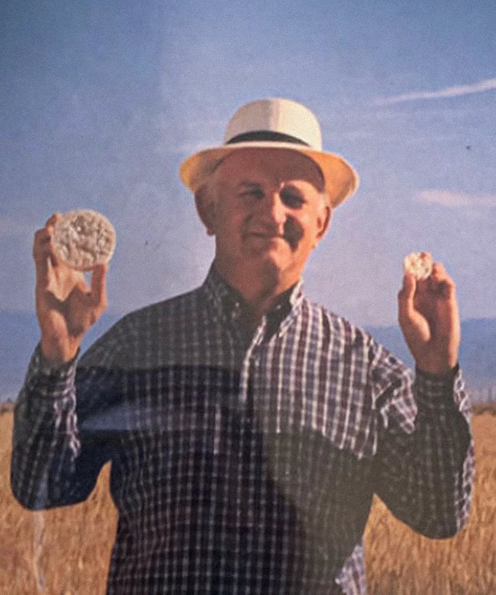 Harlan Lundberg holding up rice cakes