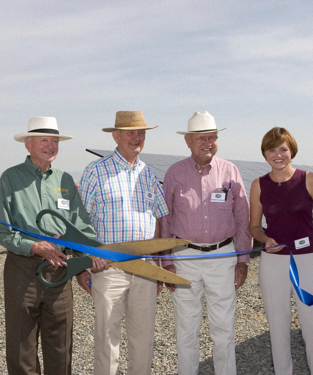 Lundberg family members cutting a ribbon