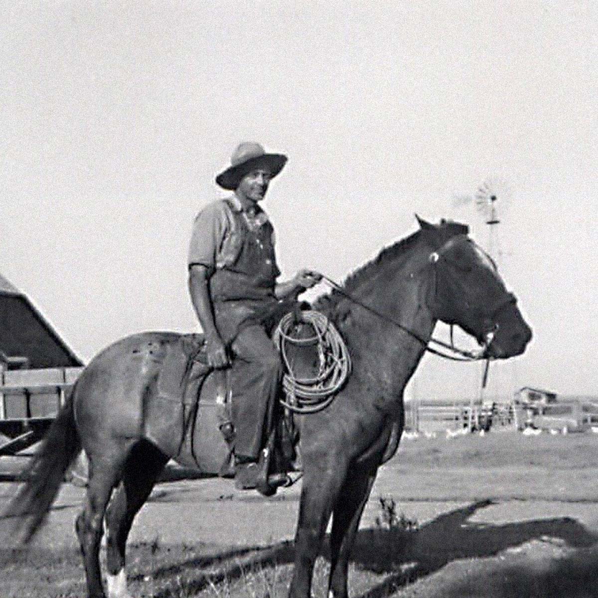 old black and white photo of Albert Lundberg sitting on a horse